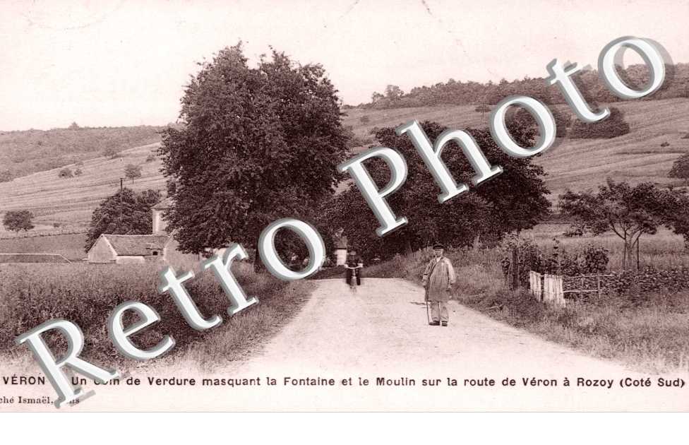 Un Coin de l'Eglise masquant la Fontaine et le Moulin sur la Route de Veron a Rozoy
