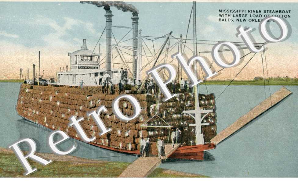 Mississipi river steam boat with large load of cotton bales